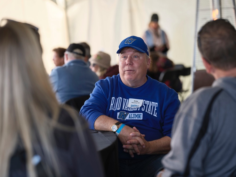 Andy Beachnau sitting at table with people